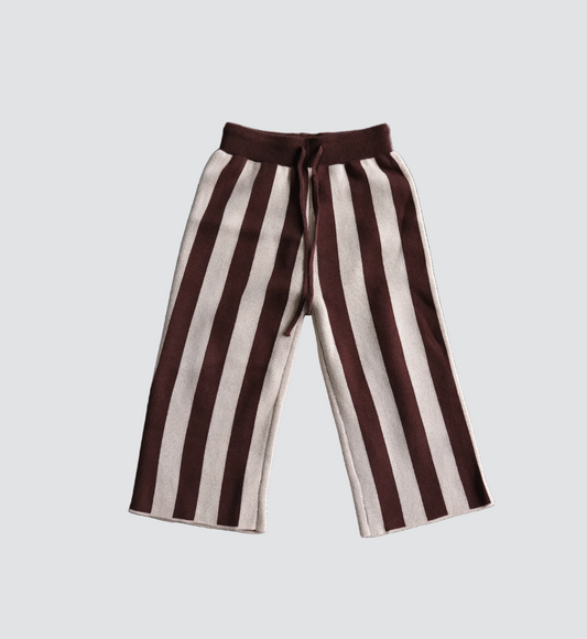 Brown and white striped pants on a white background